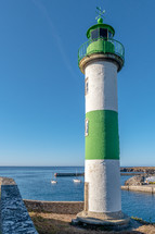 green and white lighthouse 