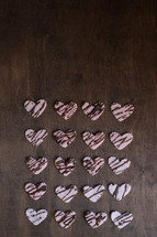 heart shaped cookies on a wood background 