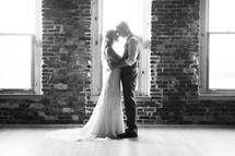 bride and groom hugging in a portrait 