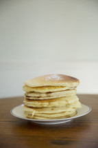 powdered sugar on a stack of pancakes 