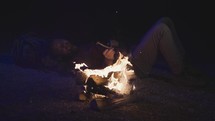 sleeping beside of a campfire 