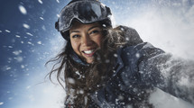 Exhilarated young woman in ski gear enjoying a snow day.
