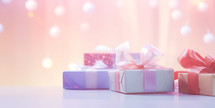 Christmas background with gift boxes, ribbon and glitter light bokeh.