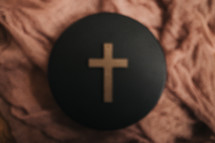 cross on a black circle defocused 