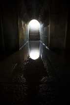 reflection in water in a tunnel 