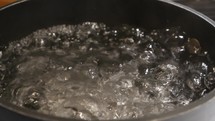 Water boiling in a pot on the stove