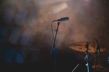 microphone and cymbal on stage at a concert 