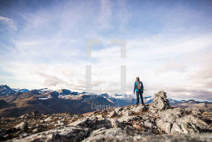 woman standing on a mountaintop 