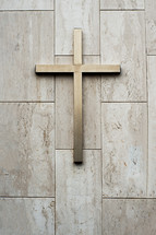 Cross on top of a marble wall