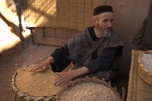A man selling grains in the market in biblical times 
