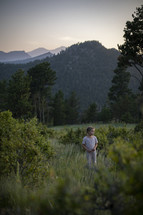 a little girl outdoors in a field in summer 