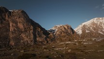 Aerial view of Albanian alps, snowy mountain range at sunset