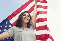 young woman holding an American flag