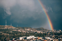 A rainbow in a sunny blue sky