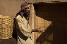 a man selling grains at the market in biblical times 