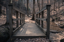 wood footbridge over a creek 