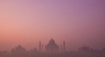 Taj Mahal in purple sky and fog 