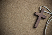 wooden cross and a leather cord 