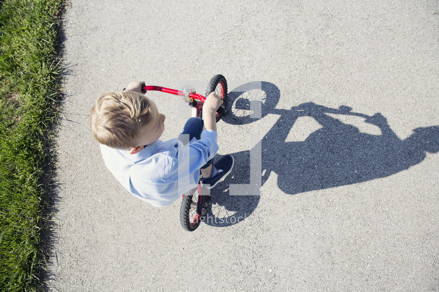 boy child riding a bike 