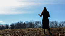 a woman alone in a field 