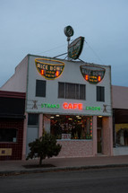 Small town restaurant with neon signs and Christmas lights