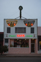 Small town restaurant with neon signs and Christmas lights