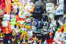 Multiple Hindu gods in a street market in India.