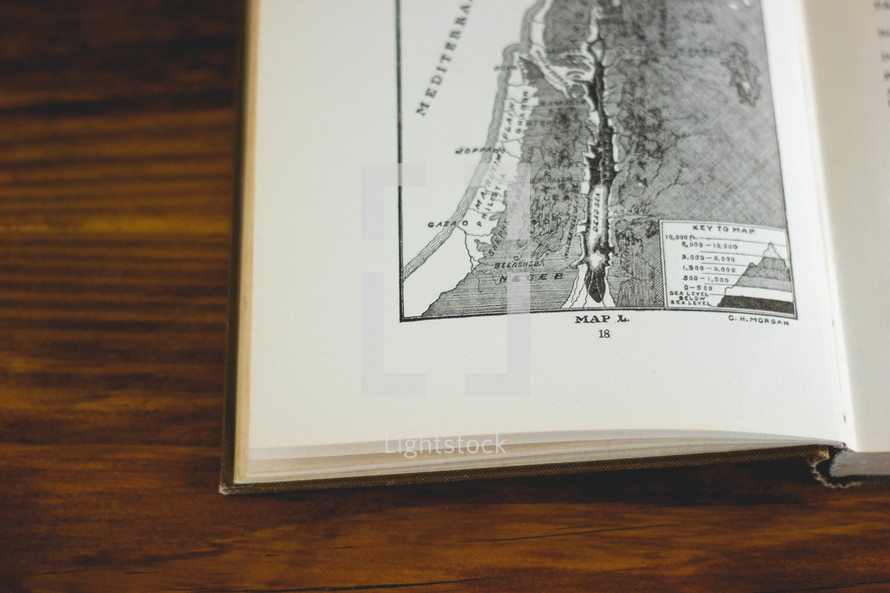 a map on the pages of a Bible 
