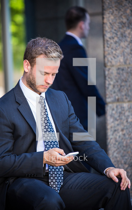 businessman checking a cellphone 