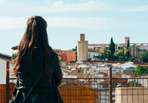 woman looking out at city of Badajoz, Extremadura, Spain.