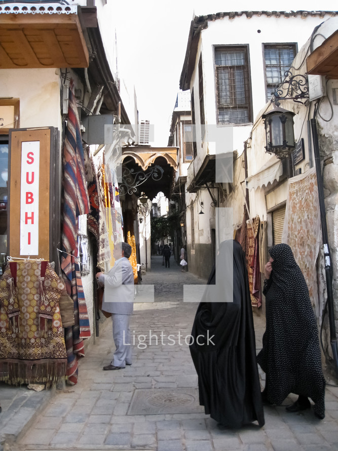 Muslim women walking on a street in Damascus 