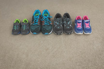 row of tennis shoes of a family 
