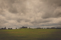 Stormy sky over a grassy plain.