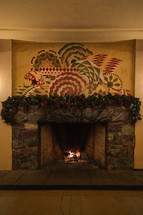 Decorative mantle over large stone fireplace