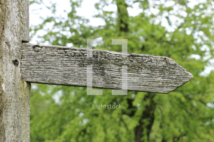 Directional wooden arrow sign