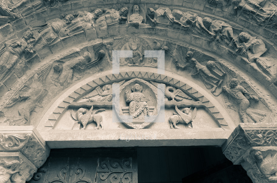 carvings on the exterior of an old cathedral in France 