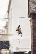 shoes hanging from a power line 