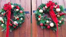 Christmas wreaths on red doors 