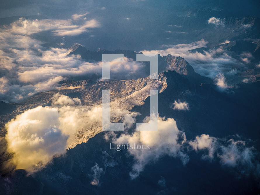 above clouds and mountain peaks 