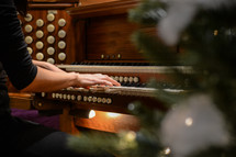 woman playing an organ 