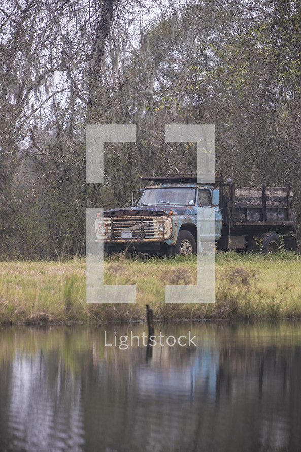 old farm truck and pond 