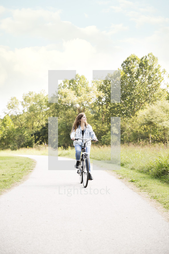 a woman riding a bicycle 