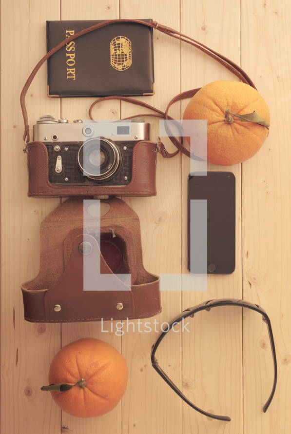 passport, orange, camera, sunglasses, camera bag 