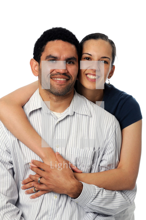 A woman with her arms around a man.
