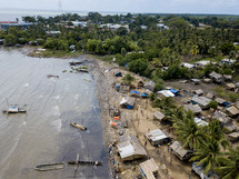 aerial view over a coastal village 