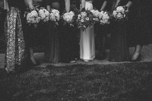 bride and bridesmaids holding bouquet 