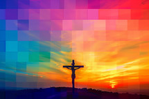The cross silhouetted against a colorful background
