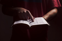 a man pointing to scripture