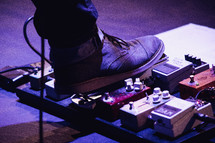 foot on a guitar pedal 