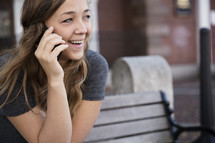 a young woman talking on a cellphone 
